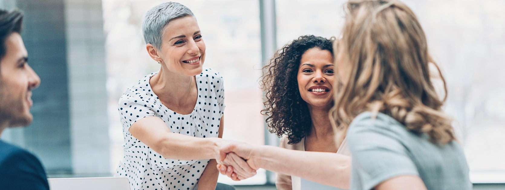 smiling and shaking hands