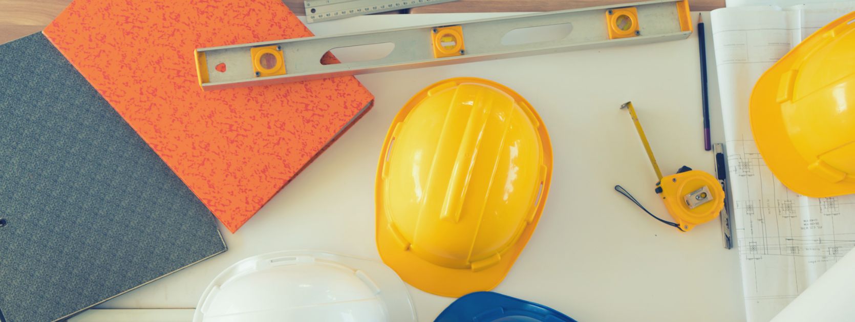 Inspecting construction plans, viewed from above.